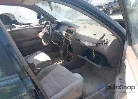 1997 Toyota Corolla Dx z USA, uszkodzony, nr VIN 1NXBB02E2VZ591343